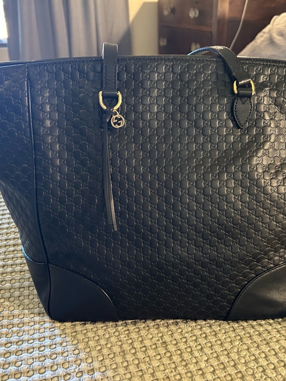 Gucci Microguccissima Black Leather Tote with Gold Accents and zip closure